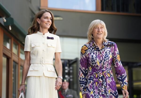 Britain's Kate, Princess of Wales, with AELTC chair Debbie Jevans, right, arrives to attend the women's singles final between Poland's Iga Swiątek and Amanda Anisimova of the US at the Wimbledon Tennis Championships in London, Saturday, July 12, 2025. (Jordan Pettitt/Pool via AP)