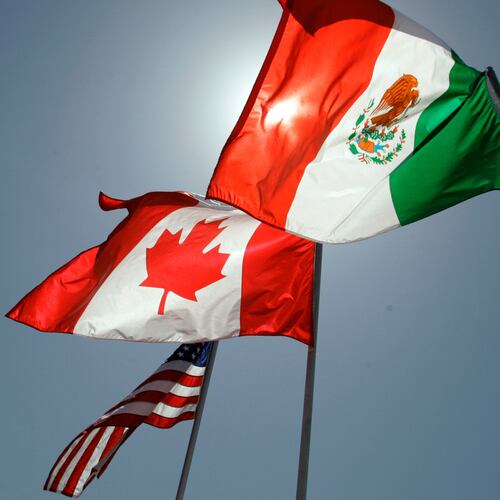 FILE - National flags representing the United States, Canada, and Mexico fly in the breeze in New Orleans where leaders of the North American Free Trade Agreement met on April 21, 2008. (AP Photo/Judi Bottoni, File)
