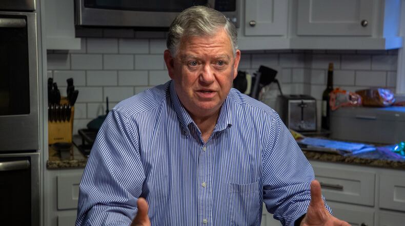 Randy Michael talks about his parent college student loan debt in his Alpharetta kitchen on Oct. 29, 2021. (Steve Schaefer for The Atlanta Journal-Constitution)