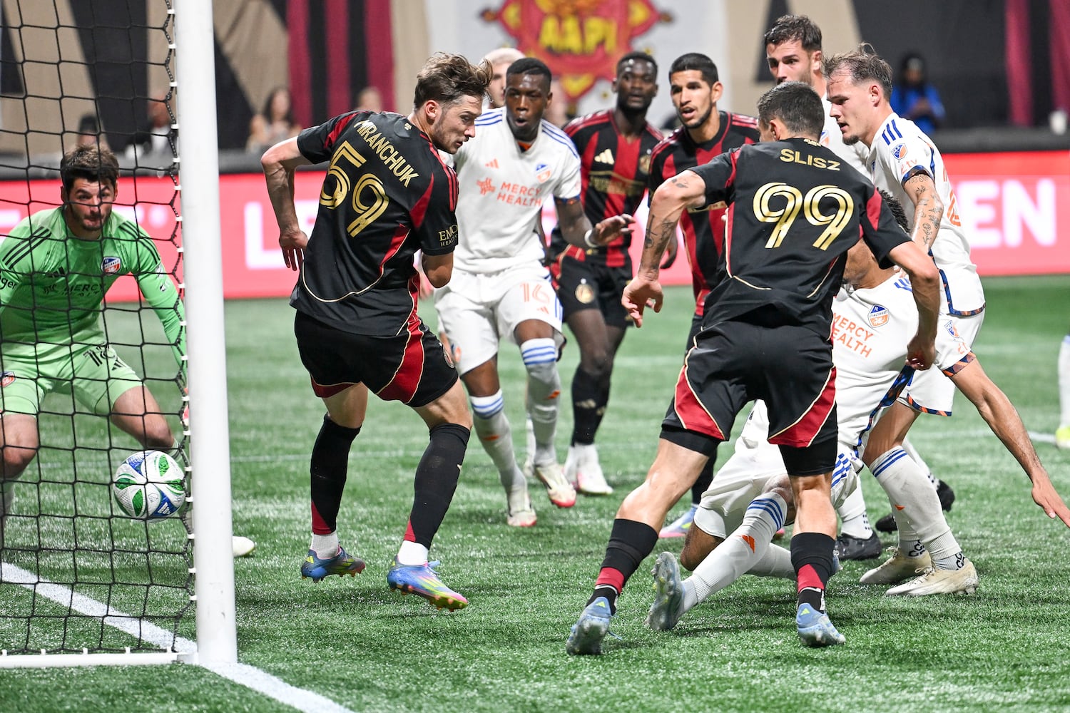 Atlanta United midfielder Bartosz Slisz (99) kicks a goal against FC Cincinnati during the second half of a MLS soccer game Sunday, May 25, 2025 at the Mercedes-Benz Stadium. (Daniel Varnado/For the Atlanta Journal-Constitution)