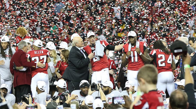 January 22, 2017, Atlanta: Arthur Blank, Matt Ryan, Julio Jones and the Falcons celebrate beating the Packers 44-21 in the NFL football NFC Championship game on Sunday, Jan. 22, 2017, in Atlanta. Curtis Compton/ccompton@ajc.com