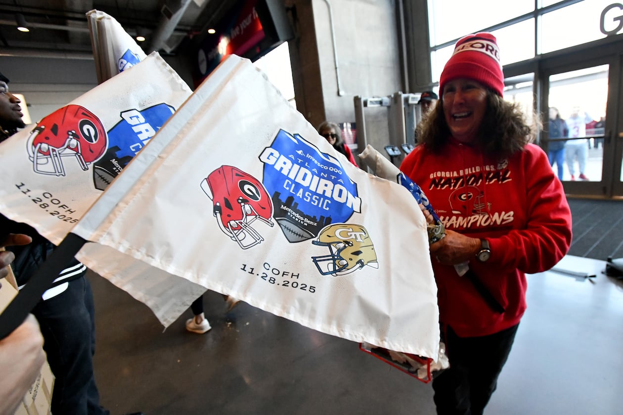Georgia Tech and Georgia fans arrive before the start of the Georgia Tech vs Georgia football game at Mercedes-Benz Stadium, Friday, November 28, 2025 in Atlanta. (Hyosub Shin / AJC)