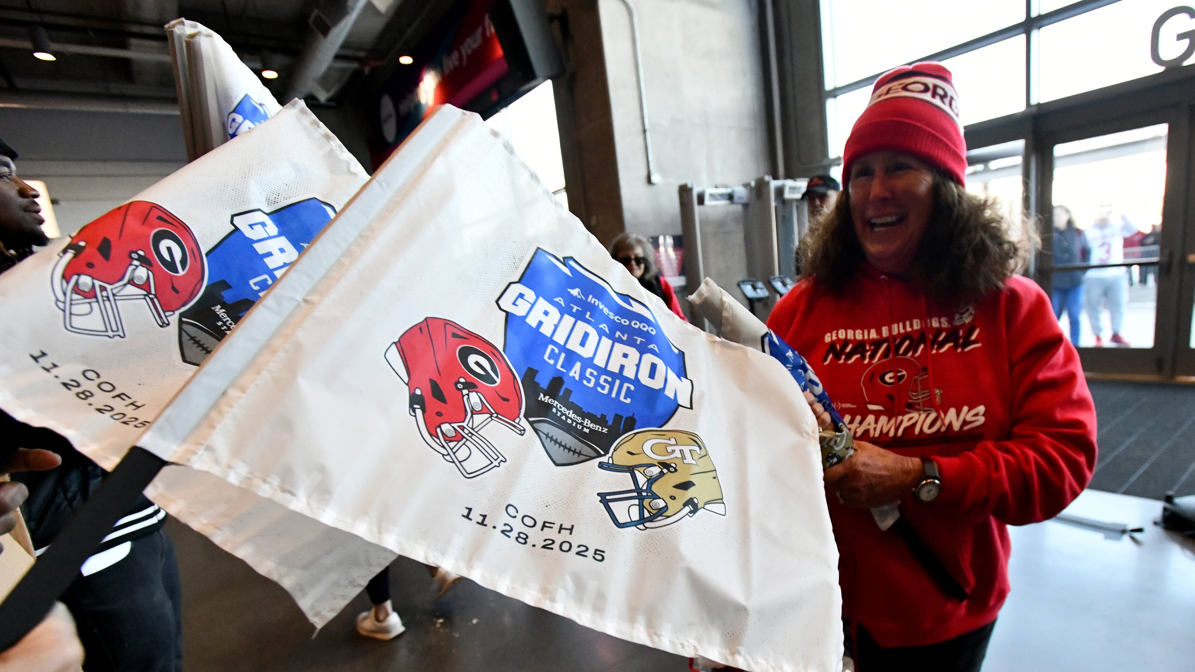 Georgia Tech and Georgia fans arrive before the start of the Georgia Tech vs Georgia football game at Mercedes-Benz Stadium, Friday, November 28, 2025 in Atlanta. (Hyosub Shin / AJC)