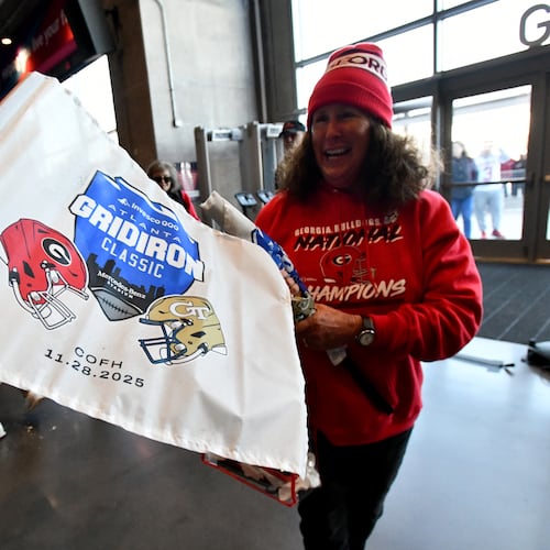 Georgia Tech and Georgia fans arrive before the start of the Georgia Tech vs Georgia football game at Mercedes-Benz Stadium, Friday, November 28, 2025 in Atlanta. (Hyosub Shin / AJC)