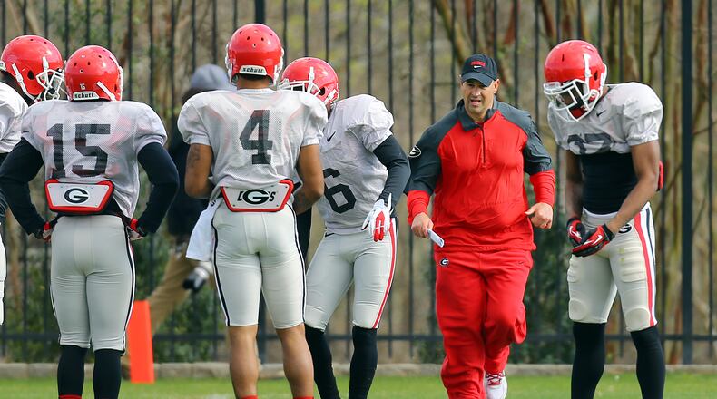 032514 ATHENS: Georgia new defensive coordinator Jeremy Pruitt is on the run keeping his defensive players moving through drills during team practice on Tuesday, March 25, 2014, in Athens. CURTIS COMPTON / CCOMPTON@AJC.COM Jeremy Pruitt has been given free rein to fix Georgia's defense. (Curtis Compton, AJC)