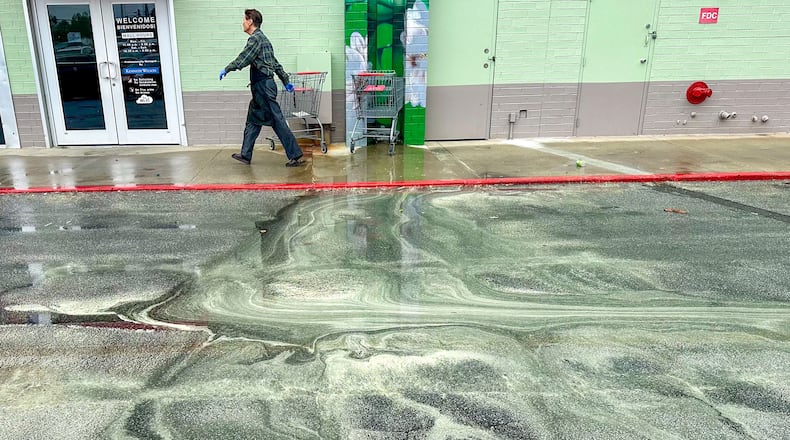 A person walks outside Plaza Fiesta on Buford Highway on Friday, March 22, 2024. This year has brought near-record levels of pollen to metro Atlanta, but a spring rain helps wash some of it out of the air.  Miguel Martinez /miguel.martinezjimenez@ajc.com