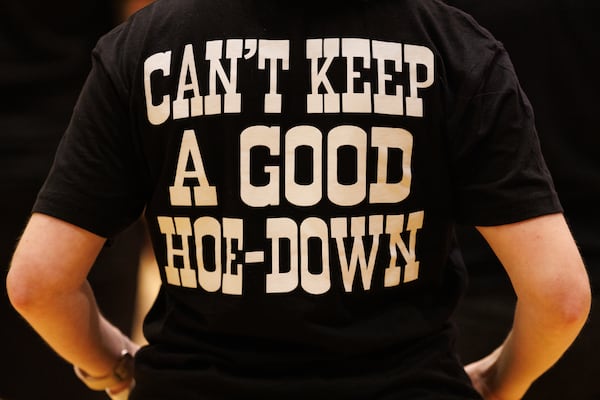 Attendees wear Hoedown South merchandise on Aug. 1, 2026 in Atlanta.  The Hoedown South is the city’s first queer country dance convention. (Estela Muñoz/AJC) 