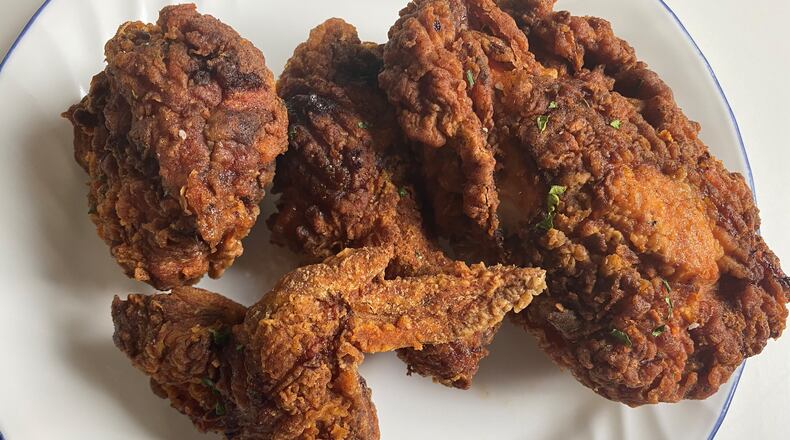 Chicken Out's four-piece crispy fried chicken comes with biscuits and the choice of a side. Bob Townsend for The Atlanta Journal-Constitution
