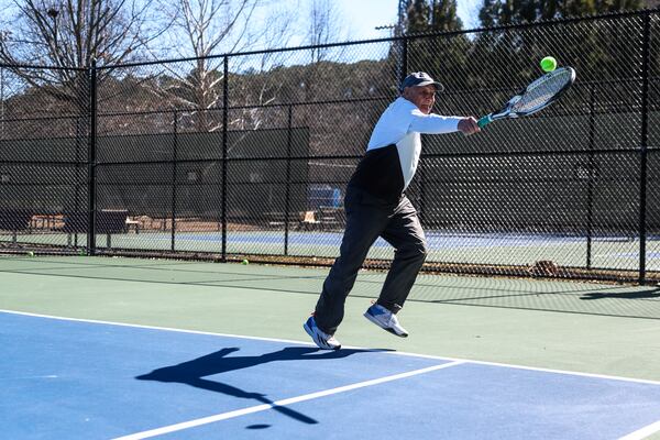 John Lamb, 90, plays tennis at Mountain Park Park in Lilburn, Ga., on Thursday, Feb. 12, 2026. Lamb says staying active is the secret to aging well. (Abbey Cutrer for the AJC)