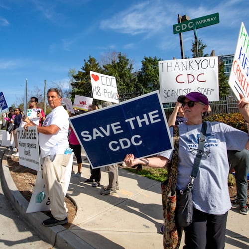 Demonstrators gathered near the Centers for Disease and Control in Atlanta earlier this month to show support for workers and protest layoffs. Jenni Girtman/For the AJC