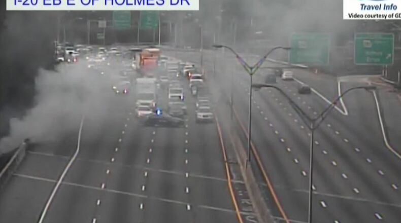 A brush fire and a multicar crash closed all lanes of I-20 near H.E. Holmes in Atlanta on Thursday.