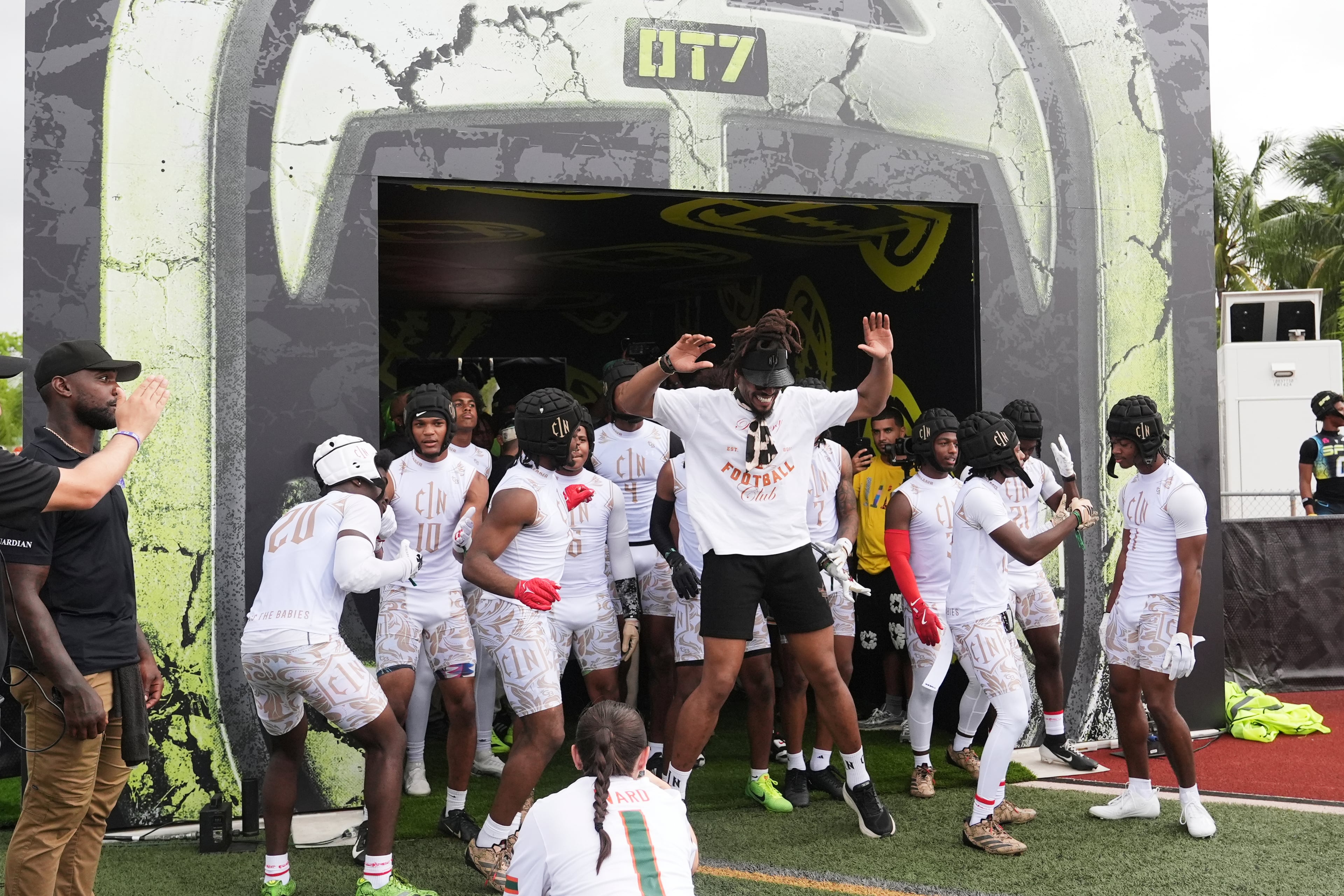 C1N coach Cam Newton, center, prepares his team to run onto the field before an OT7 football game against SFE, Friday, June 27, 2025, in Fort Lauderdale, Florida. (Lynne Sladky/AP)
