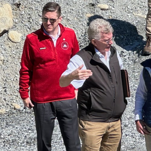 Homeland Security Secretary Markwayne Mullin, right, talks with Mayor Peter O'Leary, during a trip to survey damage caused by Hurricane Helene, Tuesday, April 7, 2026 in Chimney Rock, N.C. This is Mullin's first official trip since replacing Kristi Noem. (AP Photo Rebecca Santana)
