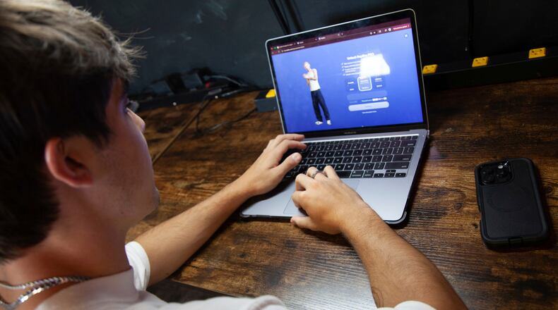 Bruce Perry, 17, demonstrates the possibilities of artificial intelligence by creating an AI companion on Character.AI,, July 15, 2025, in Russellville, Ark. (AP Photo/Katie Adkins, file)