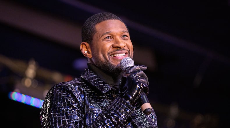 Usher speaks during a homecoming rally at Clark Atlanta University in Atlanta on Feb. 14, 2024. Along with other honors, Amazon presented a $25,000 donation to Usher's New Look Foundation. (Arvin Temkar/The Atlanta Journal-Constitution/TNS)