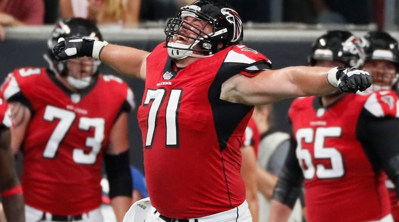 9/16/18 - Atlanta - Atlanta Falcons offensive guard Wes Schweitzer (71) celebrates after the Falcons first TD. The Atlanta Falcons played the Carolina Panthers in an NFL football game Sunday, Sept 16, 2018, at Mercedes-Benz Stadium in Atlanta, GA. BOB ANDRES /BANDRES@AJC.COM