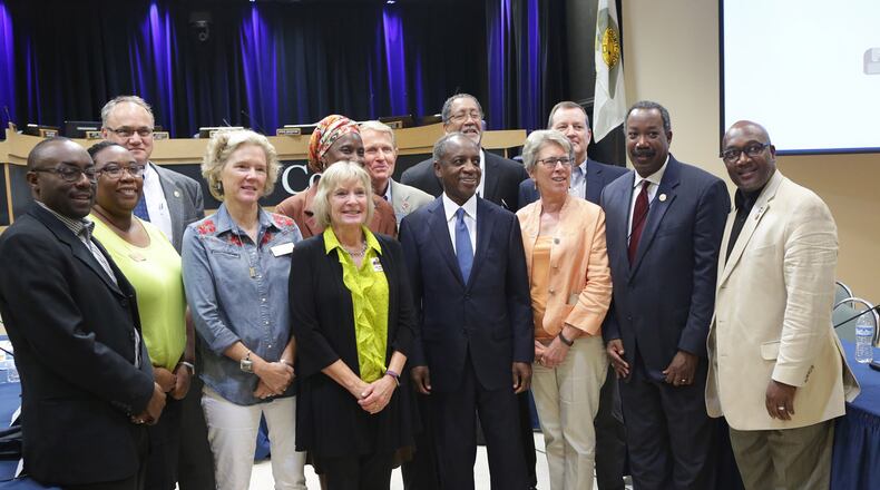 DeKalb County CEO Mike Thurmond poses for a group shot with mayors, county commissioners and city officials after their discussion Thursday of DeKalb’s proposed sales tax increase. (Akili-Casundria Ramsess/Special to the AJC)