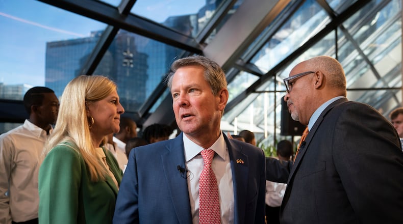 Gov. Brian Kemp (center) and first lady Marty Kemp (left) attend , and WSB radio host Shelley Wynter, right, attend an event at Venture X Buckhead in Atlanta, on Oct. 5, 2022. The governor has raised concerns about an effort to create a "Buckhead City." (Nicole Craine/The New York Times)
