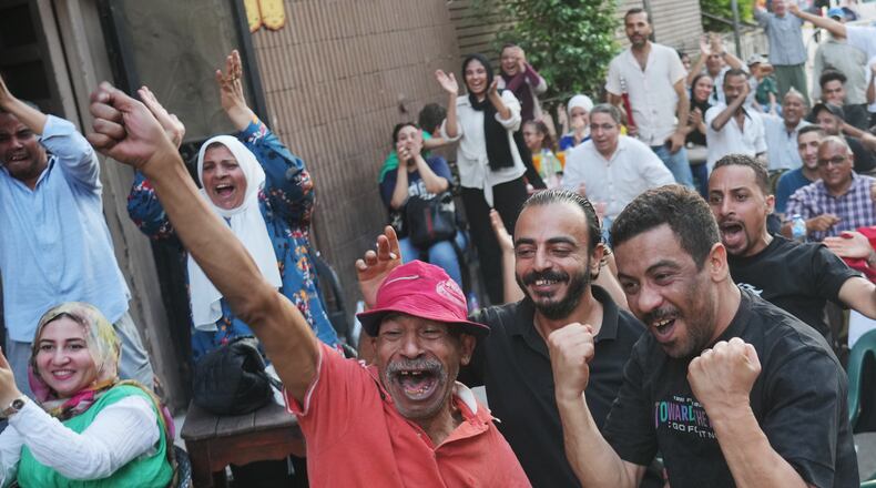 Fans celebrate Egypt's goal on Argentina during a watch party for the World Cup knockout stage, in Cairo, Egypt, Tuesday, July 7, 2026. (AP Photo/Amr Nabil)