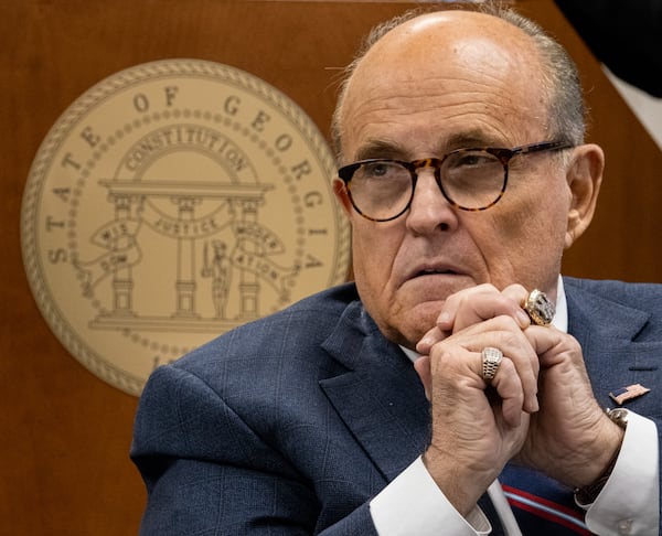 201203-Atlanta- Rudi Giuliani listens to testimony during a subcommittee of the state Senate judiciary committee meeting at the State Capitol on Thursday, Dec. 3, 2020. Giuliani was indicted on charges related to false statements he made at those meetings. Ben Gray for the Atlanta Journal-Constitution