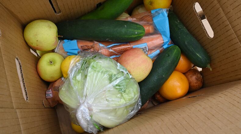 Officials and volunteers handed out fresh food to residents at a recent food distribution event in DeKalb County.