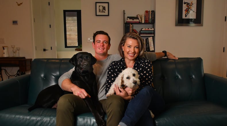 Joey Ward, executive chef and owner of Southern Belle and Georgia Boy in Atlanta, shares his home life with his wife, Emily Ward, an Atlanta lawyer, and their two dogs, Forrest and Louis. (Chris Hunt for the AJC)
