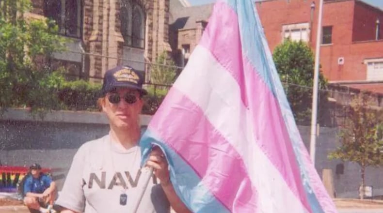 Cobb County resident Monica Helms in 2001 with the original trans pride flag she created.
Courtesy of Monica Helms