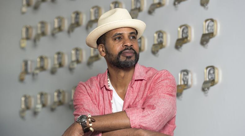 Atlanta-based artist and actor Masud Olufani poses for a portrait in his studio in Atlanta, Georgia, on Tuesday, March 21, 2017. Being an accomplished visual artist, Olufani has been involved in numerous artistic endeavors, which includes a recurring role in BET’s, “The Quad.” Olufani draws inspiration from many art forms and his artwork often informs his work on screen. (DAVID BARNES / DAVID.BARNES@AJC.COM)