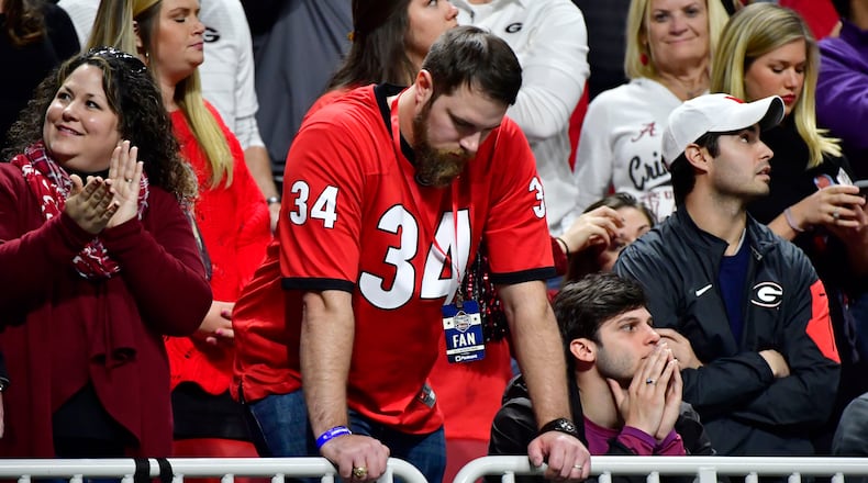 Georgia hang their heads as Alabama secures the College Football Playoff  Championship Monday, Jan. 8, 2018, at Mercedes-Benz Stadium in Atlanta.