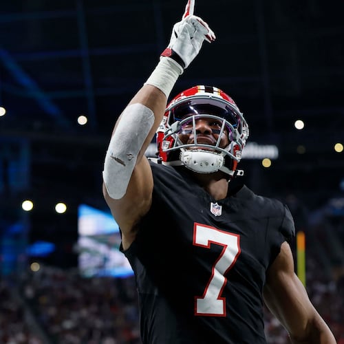 Falcons running back Bijan Robinson celebrates after scoring a touchdown against the Rams at Mercedes-Benz Stadium in Atlanta on Monday, Dec. 29, 2025. (Miguel Martinez / AJC)