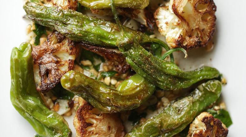 Charred cauliflower and shishito peppers with picada on April 15, 2015. (Romain Blanquart/Detroit Free Press/TNS)