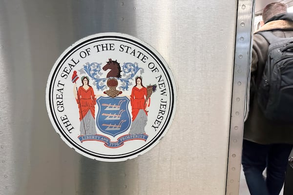 FILE - The seal of the state of New Jersey is on a New Jersey Transit train in Secaucus, New Jersey, on Saturday, December 23, 2023. (AP Photo/Ted Shaffrey, File)