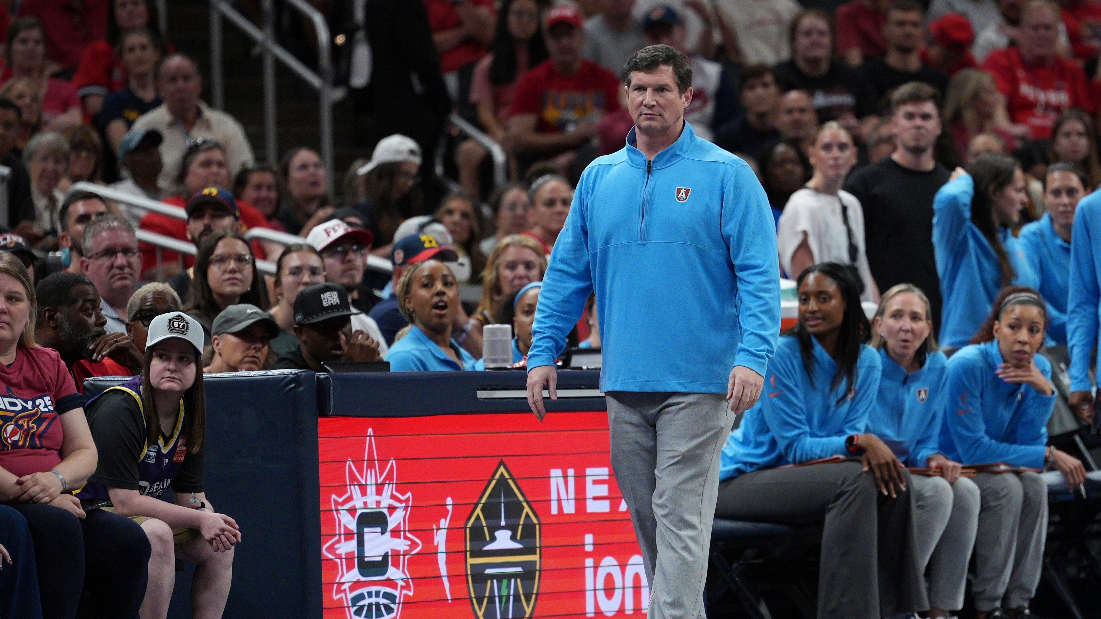 Atlanta Dream head coach Karl Smesko watches during the first half of a WNBA basketball game against the Indiana Fever, Friday, July 11, 2025, in Indianapolis. (AP Photo/AJ Mast)