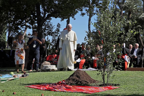 FILE - Pope Francis walks towards a newly planted oak tree during a tree-planting ceremony during the feast of St. Francis of Assisi, the patron saint of ecology, at the Vatican, Oct. 4, 2019. (AP Photo/Alessandra Tarantino, File)