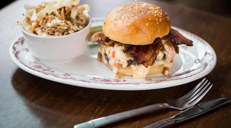 The Bee’s Knees burger at Hampton + Hudson is just that — a delightful handful of juicy beef, bacon and pimento cheese. CONTRIBUTED BY MIA YAKEL