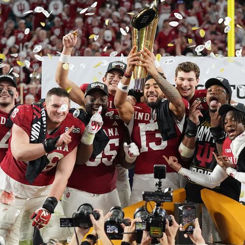 Indiana holds the trophy after their win against Miami in the College Football Playoff national championship game, Monday, Jan. 19, 2026, in Miami Gardens, Fla. (AP Photo/Lynne Sladky)