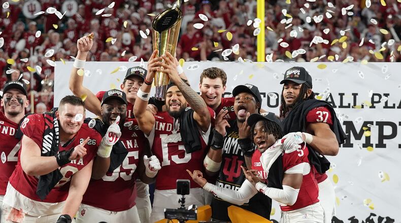 Indiana holds the trophy after their win against Miami in the College Football Playoff national championship game, Monday, Jan. 19, 2026, in Miami Gardens, Fla. (AP Photo/Lynne Sladky)