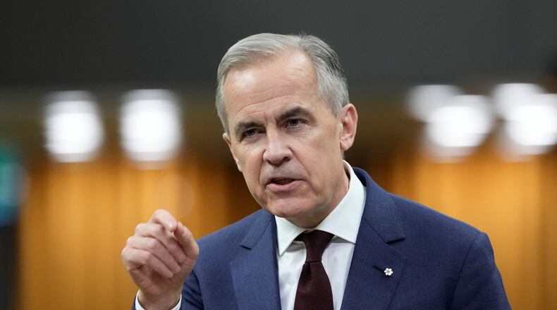 FILE - Canada Prime Minister Mark Carney rises during Question Period on Parliament Hill in Ottawa, April 15, 2026. (Adrian Wyld/The Canadian Press via AP, File)