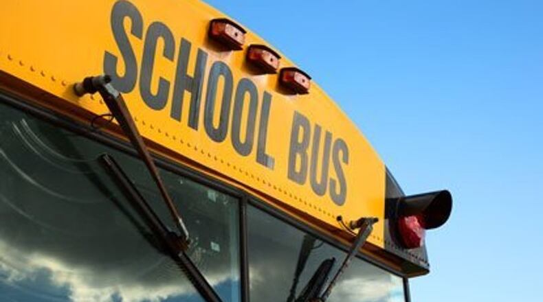 One student was killed and others were hurt when a bus overturned on a sharp curve in Middle Georgia, authorities said.