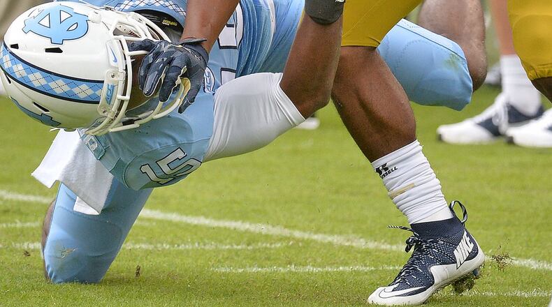 Georgia Tech freshman A-back Clinton Lynch gains some tough yards Saturday against North Carolina. (Hyosub Shin/ Hshin@ajc.com)