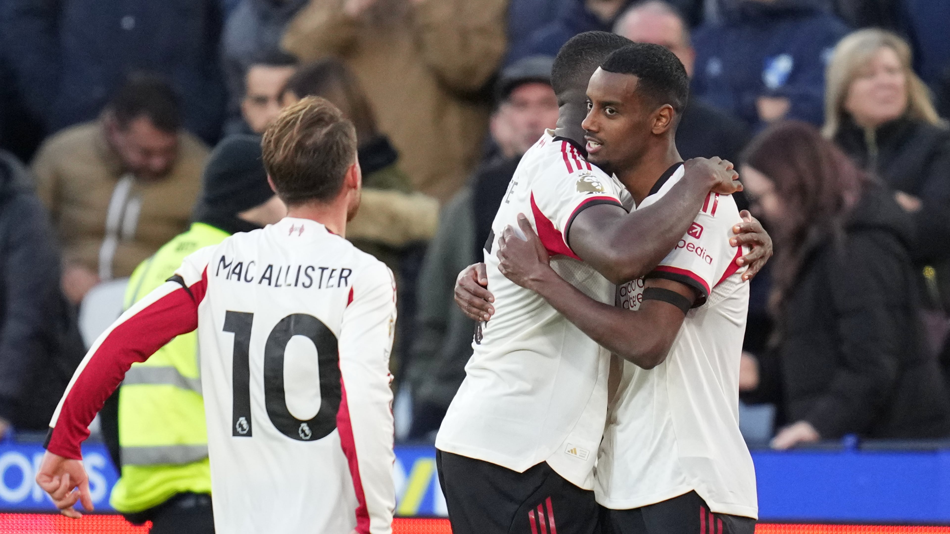Liverpool's Alexander Isak, right, celebrates after scoring the opening goal during the English Premier League soccer match between West Ham United and Liverpool, in London, Sunday, Nov. 30, 2025. (AP Photo/Kirsty Wigglesworth)