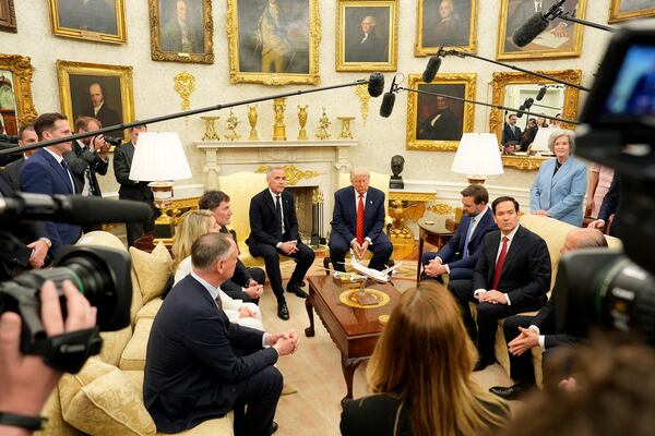Canada Prime Minister Mark Carney and U.S. President Donald Trump engage in a meeting at the White House in Washington, Tuesday, May 6, 2025. (Adrian Wyld/The Canadian Press via AP)