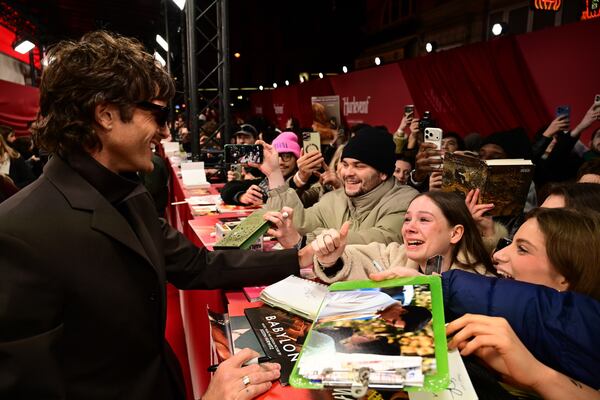 Actor Jacob Elordi, who plays Heathcliff in "Wuthering Heights," greets excited fans at a Paris premiere of the film. (Courtesy of Warner Bros. Pictures)