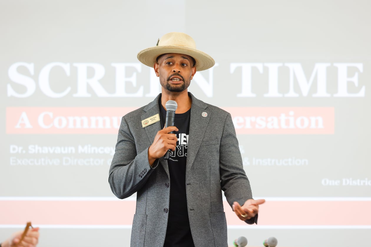 Alfred “Shivy” Brooks addresses a June town hall on the new policy. Brooks is a teacher in Clayton County and chairs the school board's policy review committee, which approved a pilot program on Thursday that limits classroom screen time. (Arvin Temkar/AJC)
