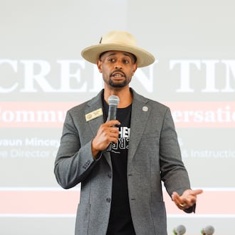 Alfred “Shivy” Brooks addresses a June town hall on the new policy. Brooks is a teacher in Clayton County and chairs the school board's policy review committee, which approved a pilot program on Thursday that limits classroom screen time. (Arvin Temkar/AJC)
