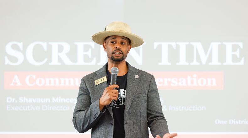 Alfred “Shivy” Brooks addresses a June town hall on the new policy. Brooks is a teacher in Clayton County and chairs the school board's policy review committee, which approved a pilot program on Thursday that limits classroom screen time. (Arvin Temkar/AJC)