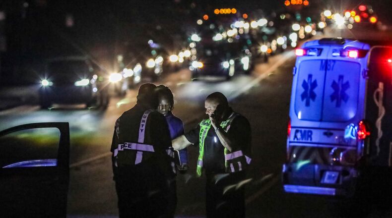We should pause to remember the lives torn apart on the roads — those in vehicles, on foot and on two-wheels.  (John Spink / John.Spink@ajc.com)