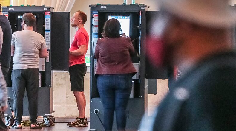 May 25, 2022 Atlanta: Voters at Park Tavern located at 500 10th Street NE, Atlanta. Voters encountered short lines and limited problems as election day got underway in Georgia on Monday, May 25, 2022 making their voices heard in one of the politically competitive states in the nation. But there were initial hiccups in a few voting locations. Some voters arrived at the polls to find their precincts had been moved to different locations. Others had short waits during the initial morning rush. Several voting locations had problems starting voting machines. In Fulton County, voting was running smoothly at almost all of the county's 250 polling sites, in part thanks to the 91,000 voters who cast their ballots during three weeks of early voting, said Interim Elections Director Nadine Williams. Two polling places, Hopewell Middle in Milton and Creel Park in South Fulton, opened 20 to 30 minutes late. Williams didn't provide a reason for the delays, but she said the county is asking a judge to allow the sites to close later so everyone can vote. She said some poll workers were 'no-shows' but they had staff in reserve. Williams encouraged folks to vote during lunch hours. The New Georgia Project, a voting rights group which monitors election issues, reported the polling place at Bethesda Elementary School in Gwinnett County opened about 30 minutes late. At North Decatur Presbyterian Church, two voting touchscreens weren't working because of a problem with their batteries, but poll workers said they had enough functioning touchscreens to avoid delays. About 70 voters cast ballots in the first hour of voting. Another voter, Marcia King, said she needed help from a poll worker to figure out how to print her ballot from the touchscreen. "This was very easy with no problems at all, and people were there to help," King said. (John Spink / John.Spink@ajc.com)