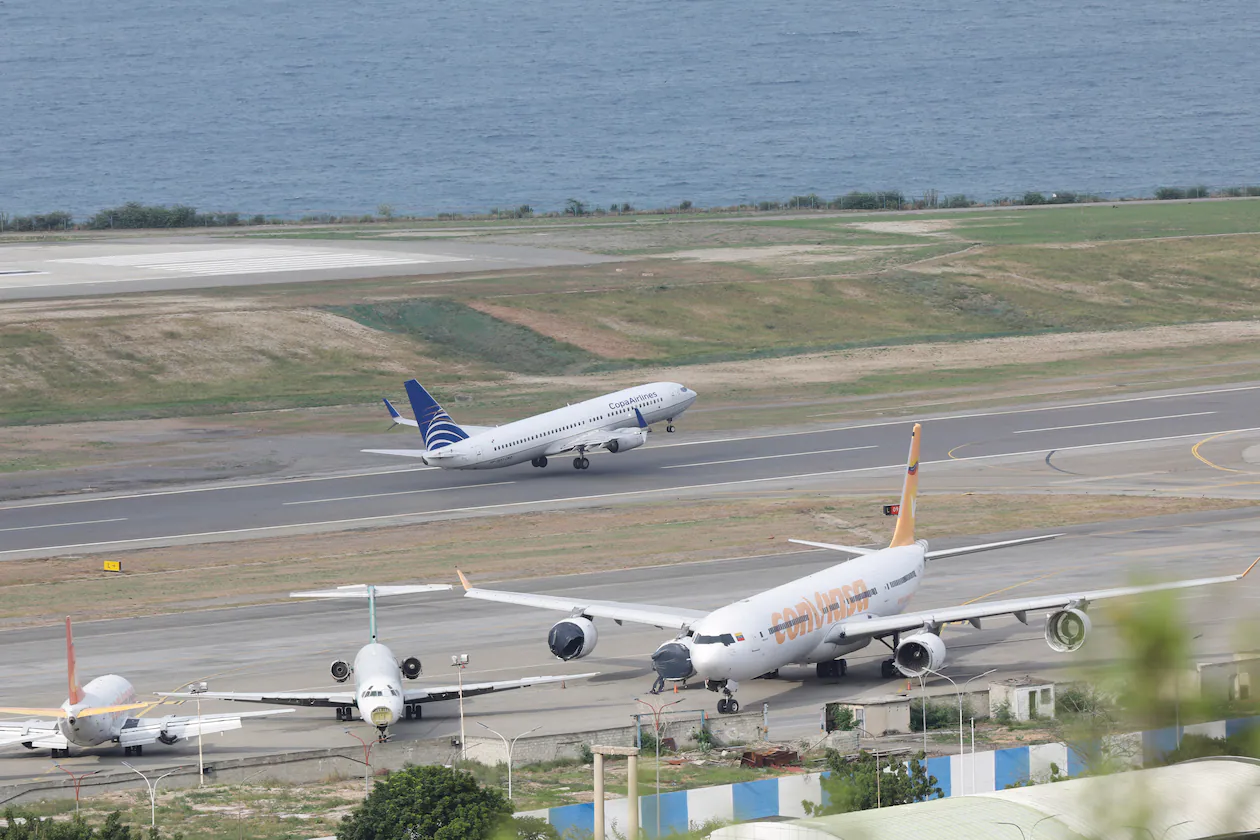 A Copa Airlines plane takes off from Simon Bolivar International Airport in Maiquetia, Venezuela, on Monday, Dec. 1, 2025, days after the government revoked operating rights for international airlines that suspended flights following a warning from the U.S. Federal Aviation Administration. (Cristian Hernandez/AP 2025)