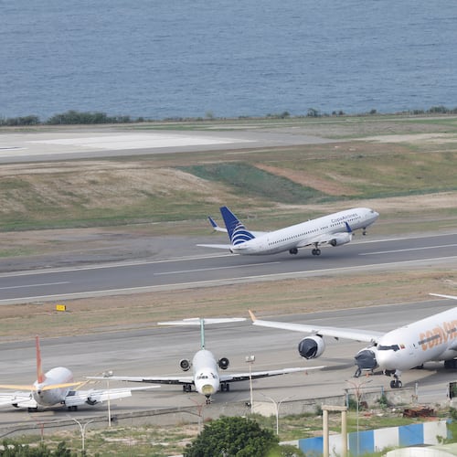 A COPA Airlines plane takes off at Simon Bolivar International Airport in Maiquetia, Venezuela, Monday, Dec. 1, 2025, days after the government revoked operating rights for international airlines that suspended flights following a warning from the U.S. Federal Aviation Administration.(AP Photo/Cristian Hernandez)